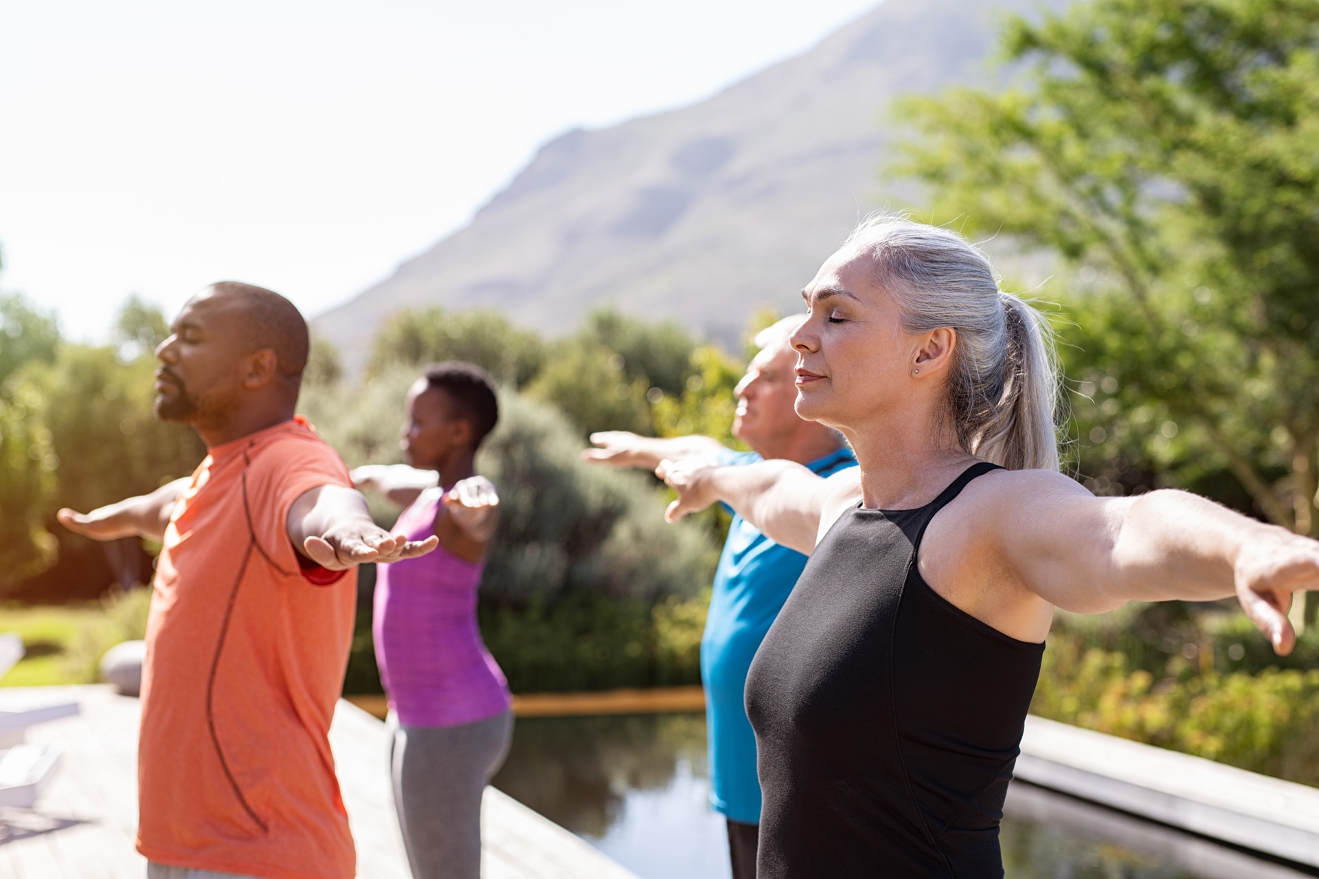 Small Phonak Audéo L-R Receiver-in Canal hearing aid group of senior people exercising