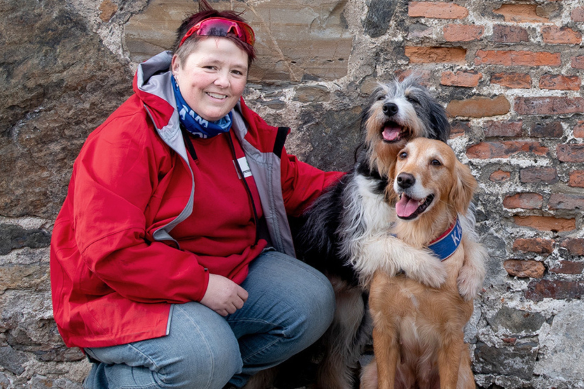 Smiling woman with her two dogs.