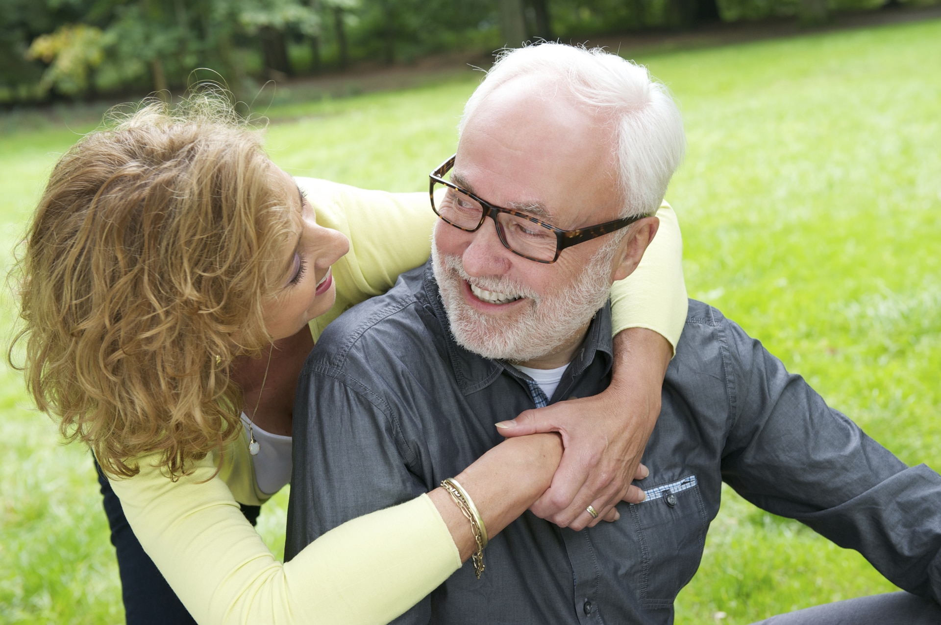 Woman and man hugging outside